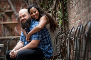 A couple poses for an engagement photo at The Firehouse in Sacramento, California.