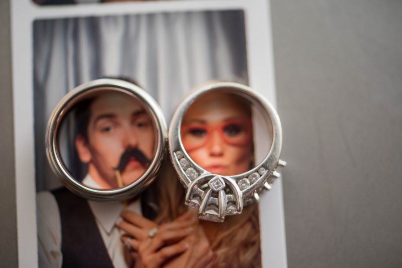 Wedding rings frame the faces of the bride and groom's photo booth image at David Girard Vineyards