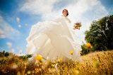 Bride in wedding dress in field of sunflowers at Fausel Ranch in Placerville, CA