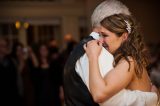 Newlywed bride cries as she dances with her father at her wedding